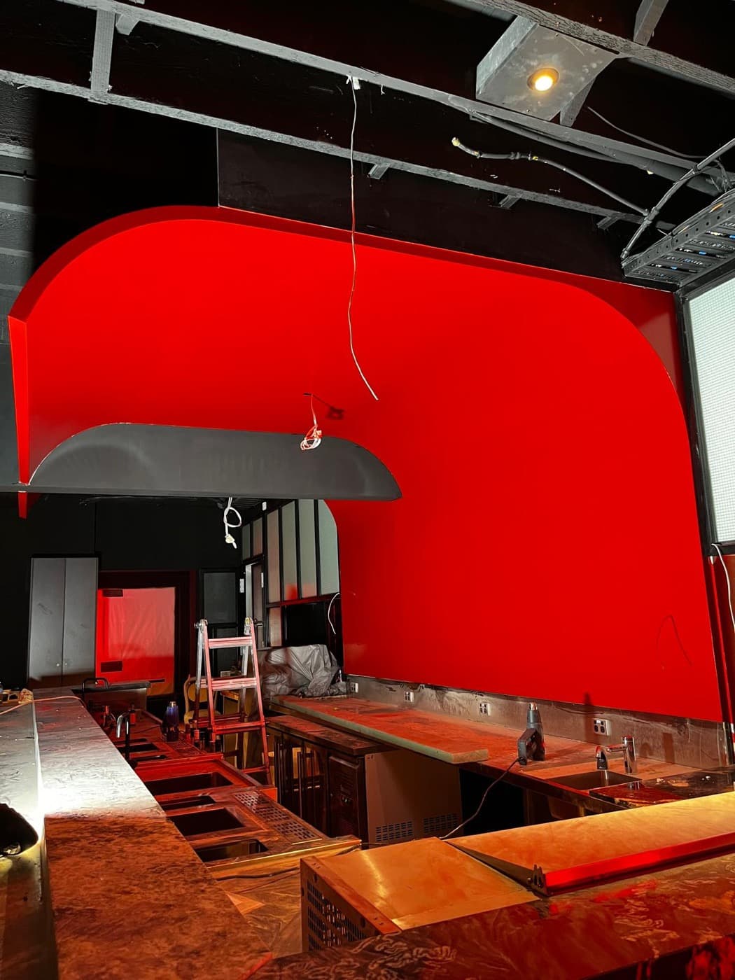 Glossy red 2-pac feature finish in a commercial fit-out