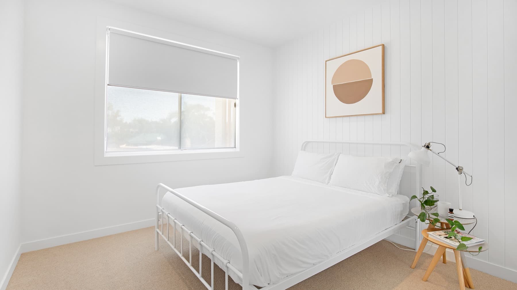 Freshly painted white bedroom with crisp trims in a Melbourne home